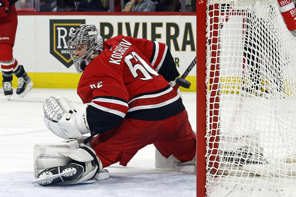 Carolina Hurricanes goaltender Pyotr Kochetkov (52) has a shot by the Columbus Blue Jackets go wide of the net during the first period of an NHL hockey game in Raleigh, N.C., Sunday, Nov. 26, 2023. (AP Photo/Karl B DeBlaker)