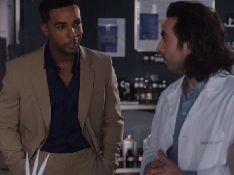 alfie talking to a worker in the perfume factory on emily in paris season three episode six