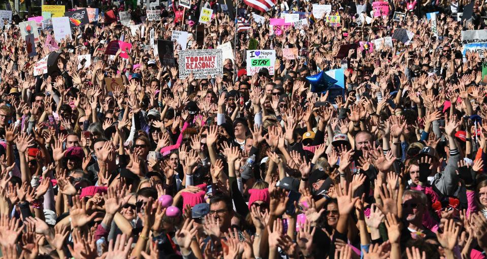 <p>Protesters, part of a 500,000 strong crowd, attend the Women’s Rally on the one-year anniversary of the first Women’s March in Los Angeles, Calif., on Jan. 20, 2018. (Photo: Mark Ralston/AFP/Getty Images) </p>