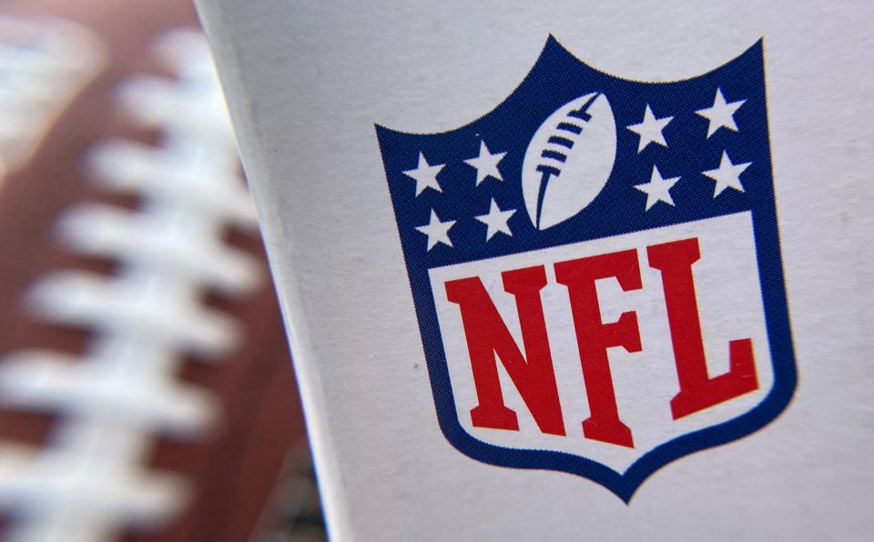 In this file photo taken on August 24, 2020 the NFL logo is seen on a football packaging in Los Angeles.