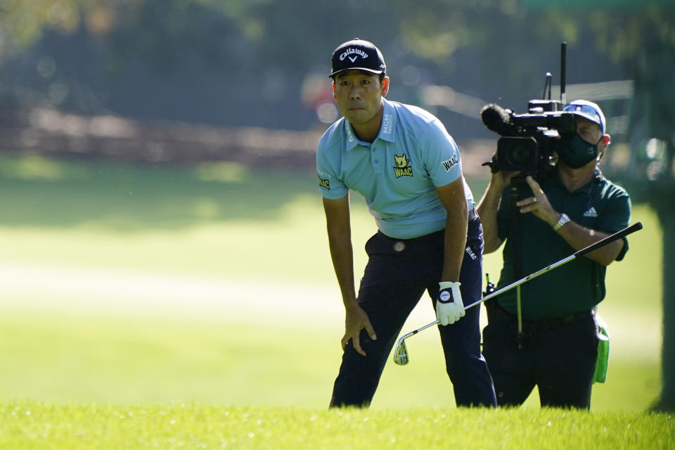 Kevin Na looks after his shot on the first fairway during the first round of the Masters golf tournament Thursday, Nov. 12, 2020, in Augusta, Ga. (AP Photo/Matt Slocum)