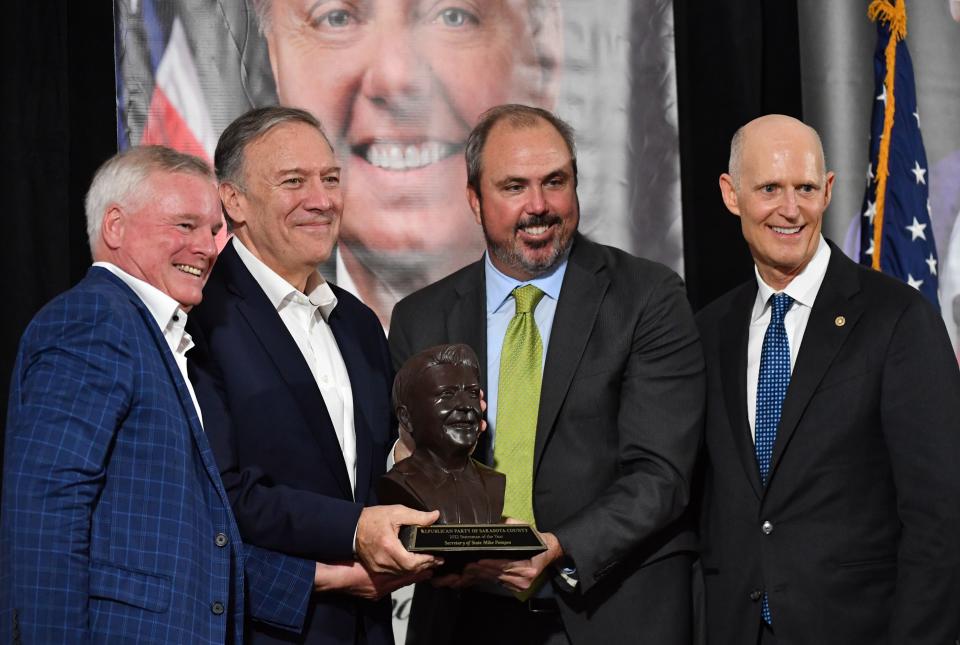 Former Secretary of State Mike Pompeo was awarded the 2022 Statesman of the Year Thursday night by the Republican Party of Sarasota County.  Posing for a photo with Pompeo, second from left, are Jack Brill, acting Chairman of the Republican Party of Sarasota County, left, Florida Senator Joe Gruters, second from right, and U.S. Senator Rick Scott. 