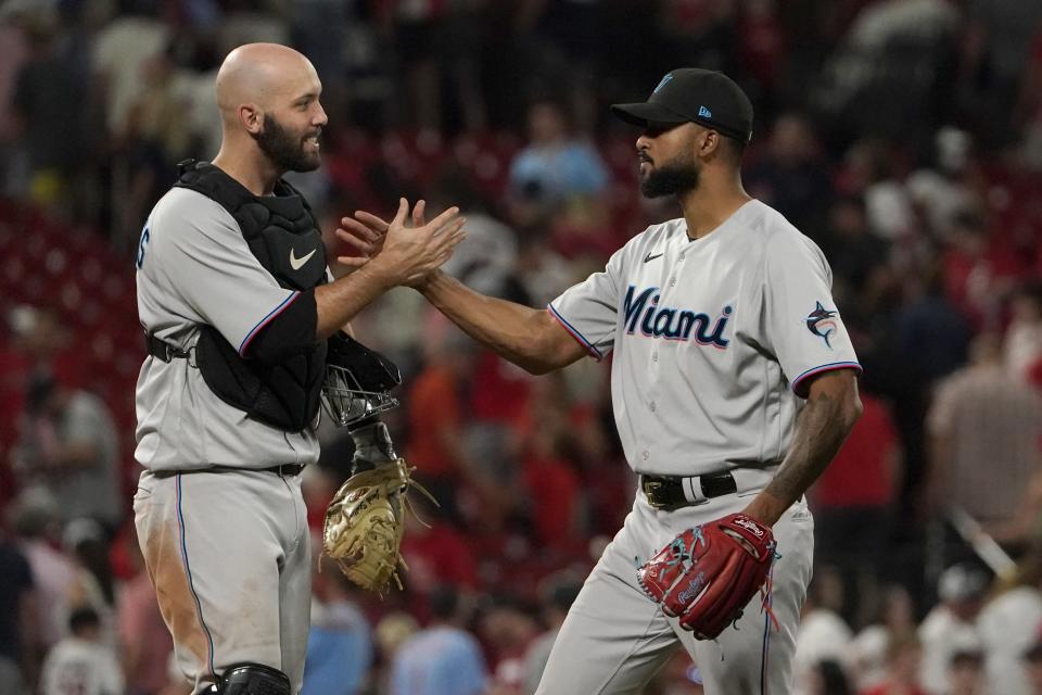 Marlins starter Sandy Alcantara is congratulated by catcher Jacob Stallings after his complete-game victory against the Cardinals in St. Louis Wednesday night.