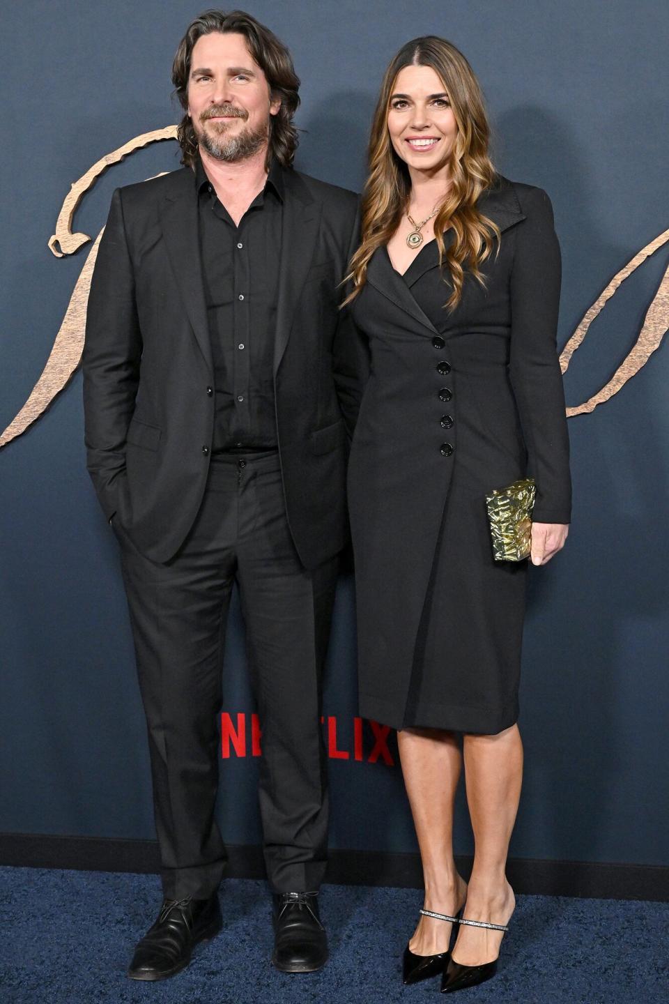 Christian Bale and Sibi Blažić attend the "The Pale Blue Eye" Los Angeles Premiere at DGA Theater Complex on December 14, 2022 in Los Angeles, California.