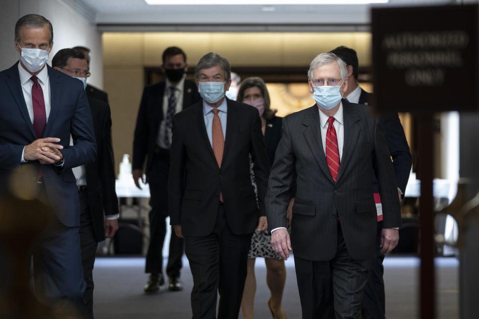 (L-R) Sen. John Thune (R-SD), Sen. Roy Blunt (R-MO) and Senate Majority Leader Mitch McConnell (R-KY) leave a Senate Republican policy luncheon in the Hart Senate Office Building on May 5.