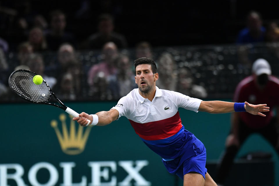 Pictured here, Novak Djokovic returns a shot against Daniil Medvedev in the Paris Masters final.