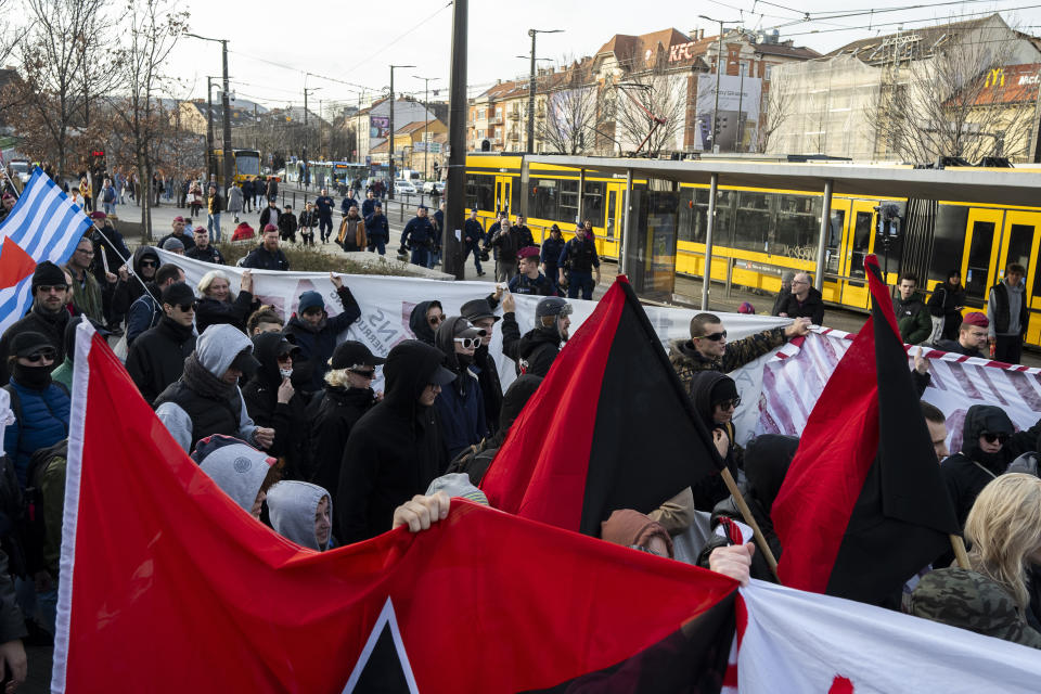 Hundreds of antifascist activists gather in Hungary's capital on Saturday to oppose an annual commemoration held by far-right groups in Budapest, Saturday, Feb. 10, 2024. (AP Photo/Denes Erdos)