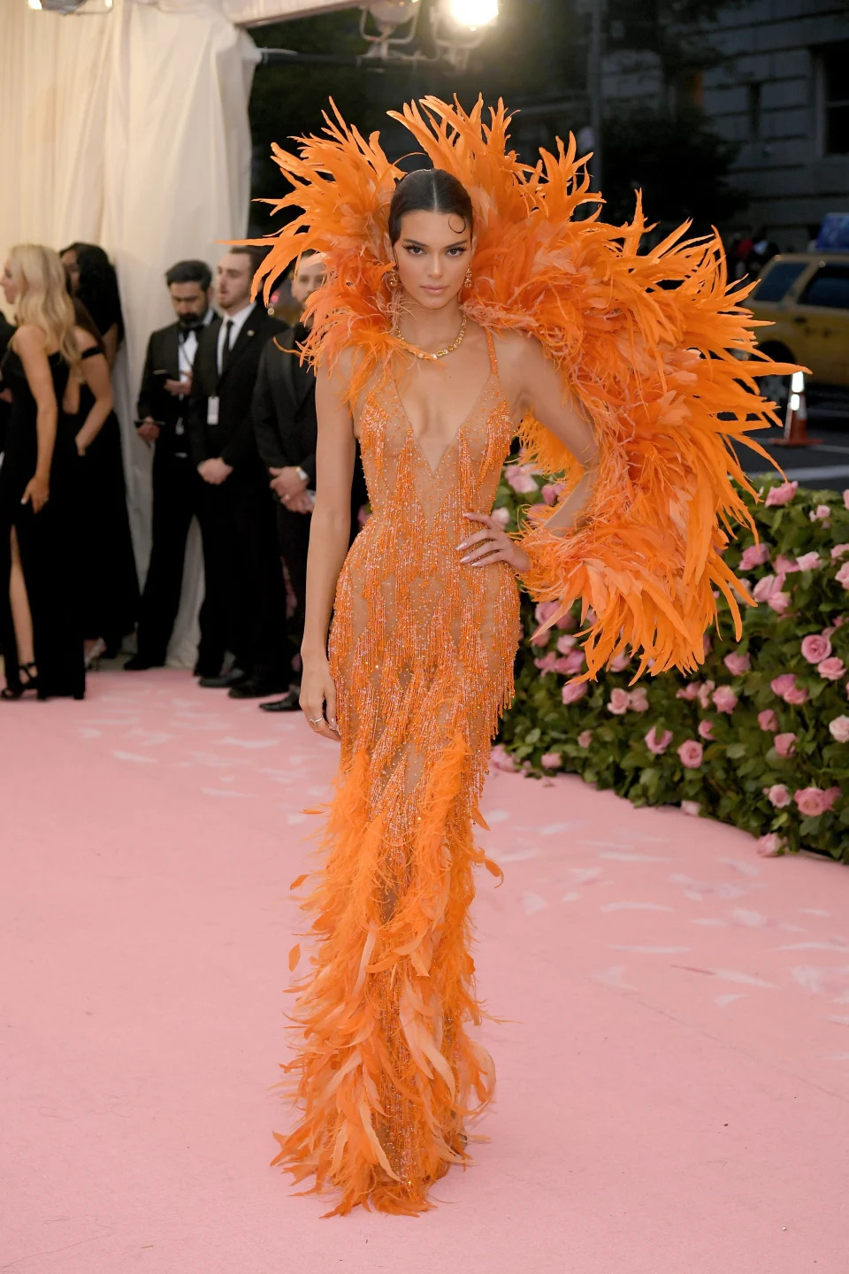 Kendall Jenner wearing an orange dress at the 2019 Met Gala.