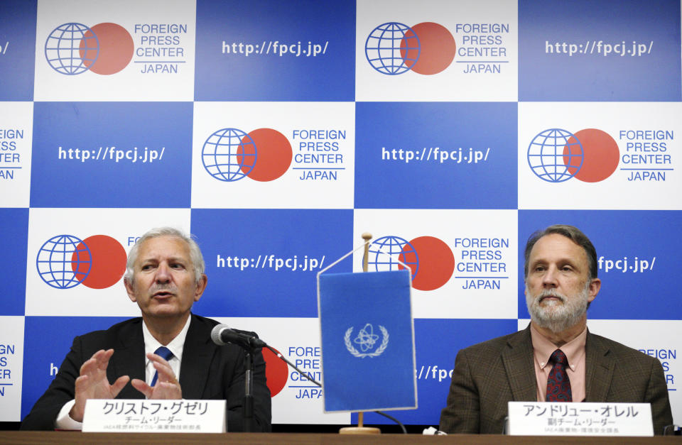 International Atomic Energy Agency (IAEA) team leader Christophe Xerri, left, Director of the IAEA's Division of Nuclear Fuel Cycle and Waste Technology, and Andrew Orrell, right, Section Head of the IAEA's Waste and Environmental Safety Section, attend during a press conference on a review Japan's decommissioning work at Fukushima Daiichi Site in Tokyo Tuesday, Nov. 13, 2018. Experts from the International Atomic Energy Agency have urged the operator of Japan’s tsunami-wrecked Fukushima nuclear plant to urgently come up with a plan to dispose of massive amounts of radioactive water stored in tanks on the compound. (AP Photo/Eugene Hoshiko)