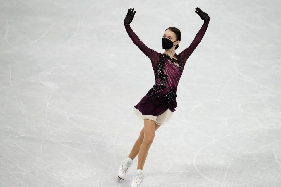 Gold medalist, Anna Shcherbakova, of the Russian Olympic Committee, poses after the women's free skate program during the figure skating competition at the 2022 Winter Olympics, Thursday, Feb. 17, 2022, in Beijing. (AP Photo/Natacha Pisarenko)