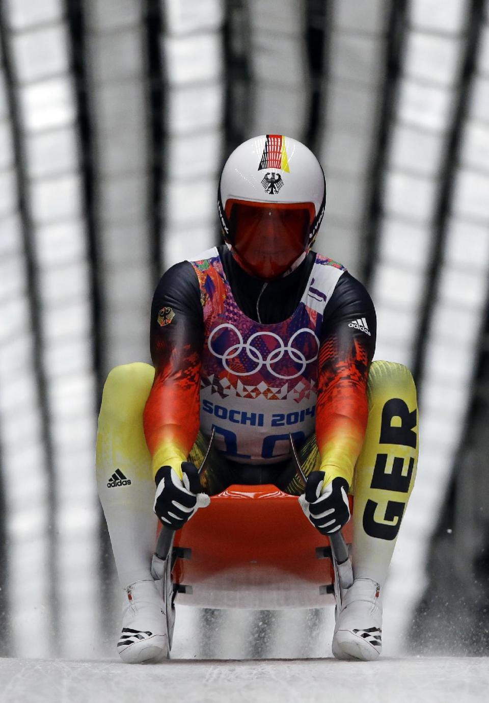 Felix Loch of Germany brakes after finishing his second run during the men's singles luge competition at the 2014 Winter Olympics, Saturday, Feb. 8, 2014, in Krasnaya Polyana, Russia. (AP Photo/Dita Alangkara)