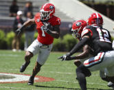 Georgia running back Trevor Etienne makes a long gain during the NCAA college football team's spring game Saturday, April 13, 2024. Curtis Compton/Atlanta Journal-Constitution via AP)