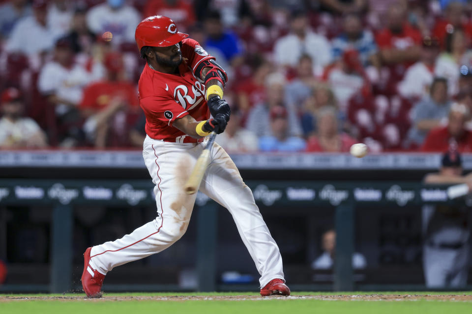 Cincinnati Reds' Delino DeShields hits an RBI single during the third inning against the St. Louis Cardinals in the second baseball game of a doubleheader in Cincinnati, Wednesday, Sept. 1, 2021. (AP Photo/Aaron Doster)