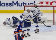 Tampa Bay Lightning goalie Andrei Vasilevskiy (88) and teammates Anthony Cirelli (71) and Ryan McDonagh (27) react after a New York Islanders goal, as Islanders' Brock Nelson (29) skates past during the second period of Game 3 of the NHL hockey Eastern Conference final, Friday, Sept. 11, 2020, in Edmonton, Alberta. (Jason Franson/The Canadian Press via AP)