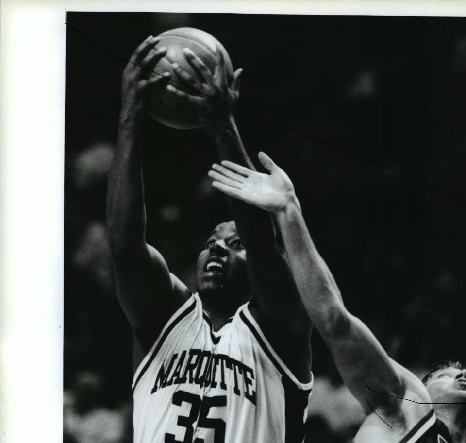 Marquette forward Damon Key grabs a rebound.