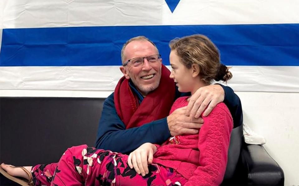 Emily Hand, 9, is reunited with her father  in Israel on Sunday