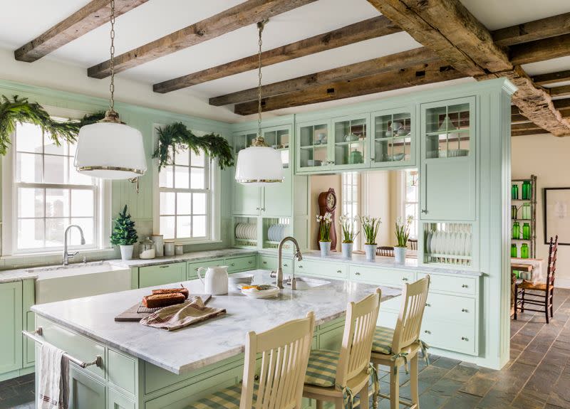 mint green kitchen cabinets with a gray marble countertop