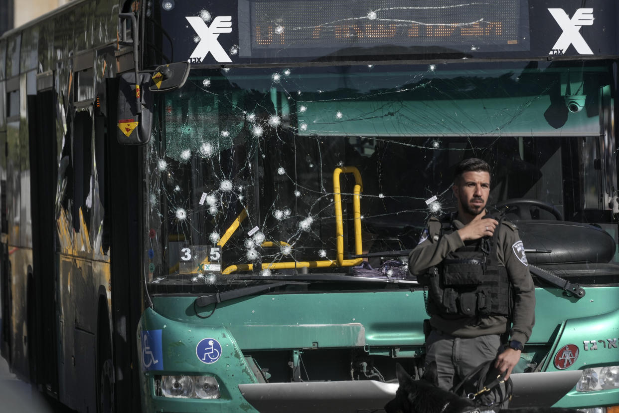 Israeli police inspect the scene of an explosion at a bus stop in Jerusalem. (Mahmoud Illean/AP)
