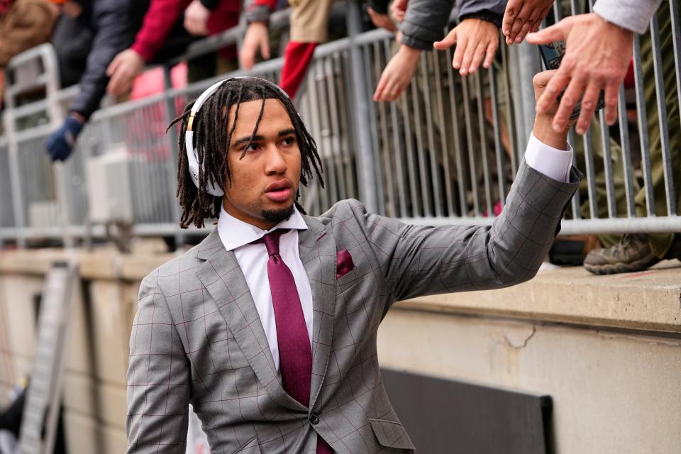 Nov 12, 2022; Columbus, Ohio, USA; Ohio State Buckeyes quarterback C.J. Stroud high fives fans as he enters Ohio Stadium prior to the NCAA football game against the Indiana Hoosiers. Mandatory Credit: Adam Cairns-The Columbus Dispatch