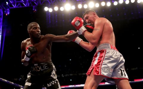 Lawrence Okolie punches Matty Askin during the British Cruiserweight Championship title fight between Matty Askin and Lawrence Okolie - Credit: Richard Heathcote/Getty Images