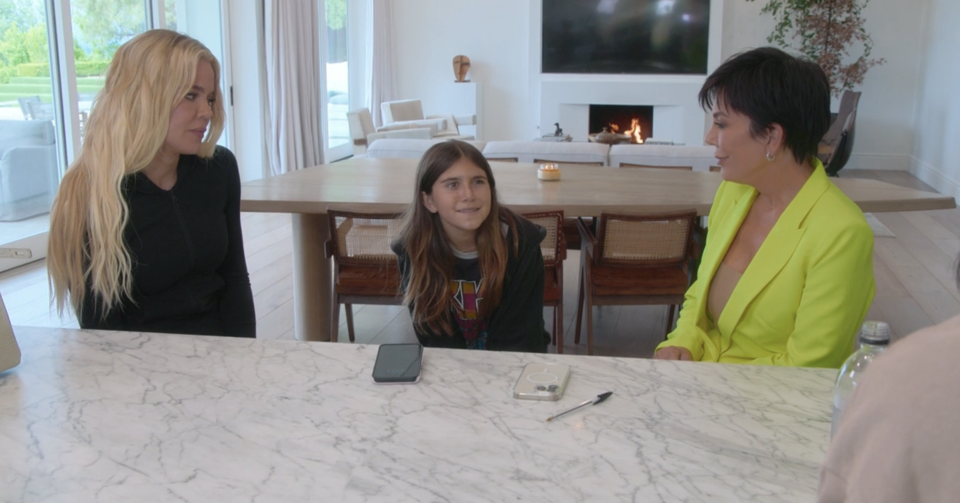 Khloé, Penelope, and Kris at a table