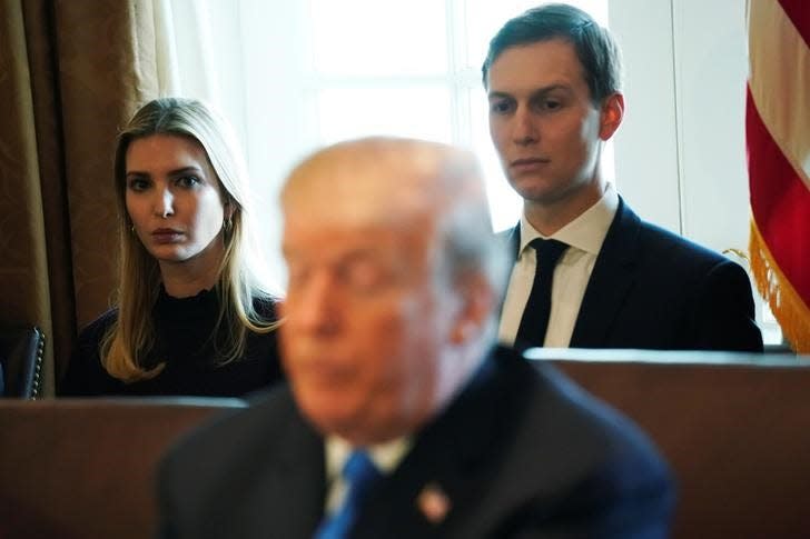 FILE PHOTO: White House senior advisor Ivanka Trump and White House senior advisor Jared Kushner sit behind U.S. President Donald Trump as he talks to reporters before a cabinet meeting at the White House in Washington, U.S. December 6, 2017.  REUTERS/Jonathan Ernst