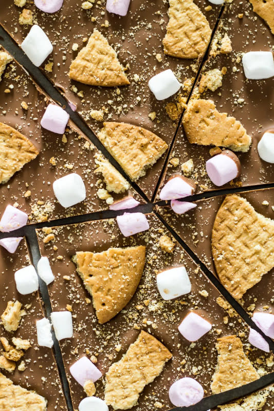 <p>Marsha’s Baking Addiction</p><p>A deliciously thick and creamy layer of milk chocolate that is generously topped with broken biscuits, and mini marshmallows!</p><p><strong>Get the recipe: </strong><a href="https://marshasbakingaddiction.com/smores-chocolate-bark/" rel="nofollow noopener" target="_blank" data-ylk="slk:S’mores Chocolate Bark;elm:context_link;itc:0;sec:content-canvas" class="link "><strong>S’mores Chocolate Bark</strong></a></p>