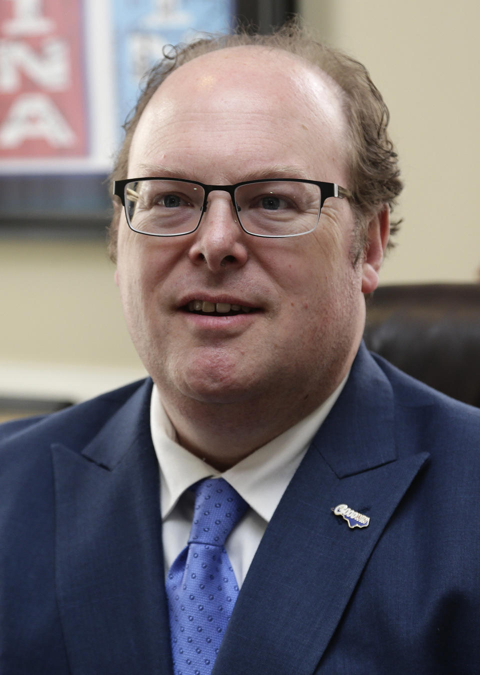 State Democratic Party Chairman Wayne Goodwin poses in his office at the Democratic party headquarters in Raleigh, N.C., Friday, April 5, 2019. Goodwin spoke to The Associated Press on Friday in his first interview since federal bribery and conspiracy charges were lodged against donor Greg Lindberg and state Republican Party Chairman Robin Hayes. (AP Photo/Gerry Broome)