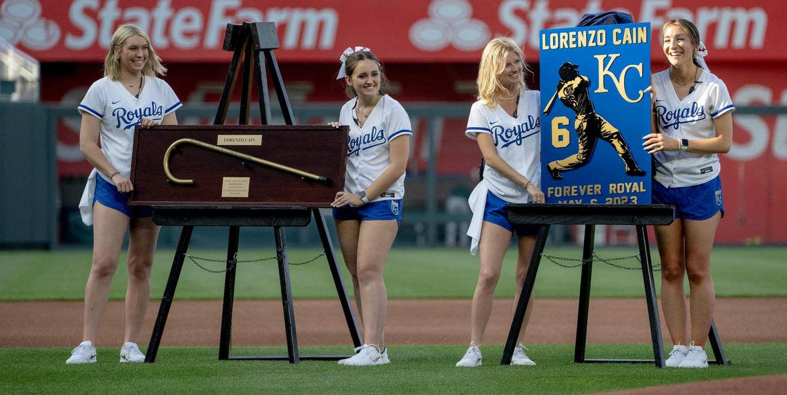 Former Kansas City Royals center fielder Lorenzo Cain was presented with a golden cane and plaque during a retirement ceremony at Kauffman Stadium on Saturday, May 6, 2023, in Kansas City. Cain signed a ceremonial one-day contract to retire as a Royal.