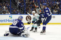 Tampa Bay Lightning goaltender Andrei Vasilevskiy (88) makes a save on a shot by Seattle Kraken right wing Jordan Eberle (7) during the third period of an NHL hockey game Friday, Nov. 26, 2021, in Tampa, Fla. Defending for the Lightning is Mikhail Sergachev (98). (AP Photo/Chris O'Meara)