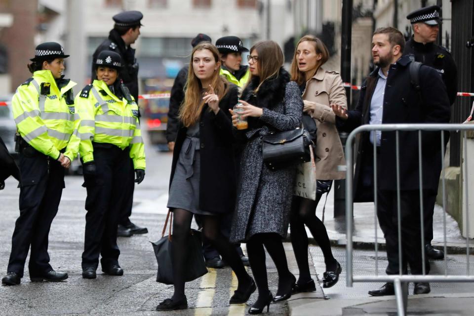 Workers are evacuated from offices on a street adjoining The Strand in central London after a gas leak: AFP/Getty Images