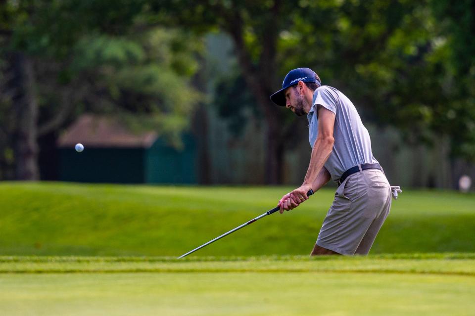 Paul Winterhalter chips onto the fifth green at the CCNB Fourball Tournament.