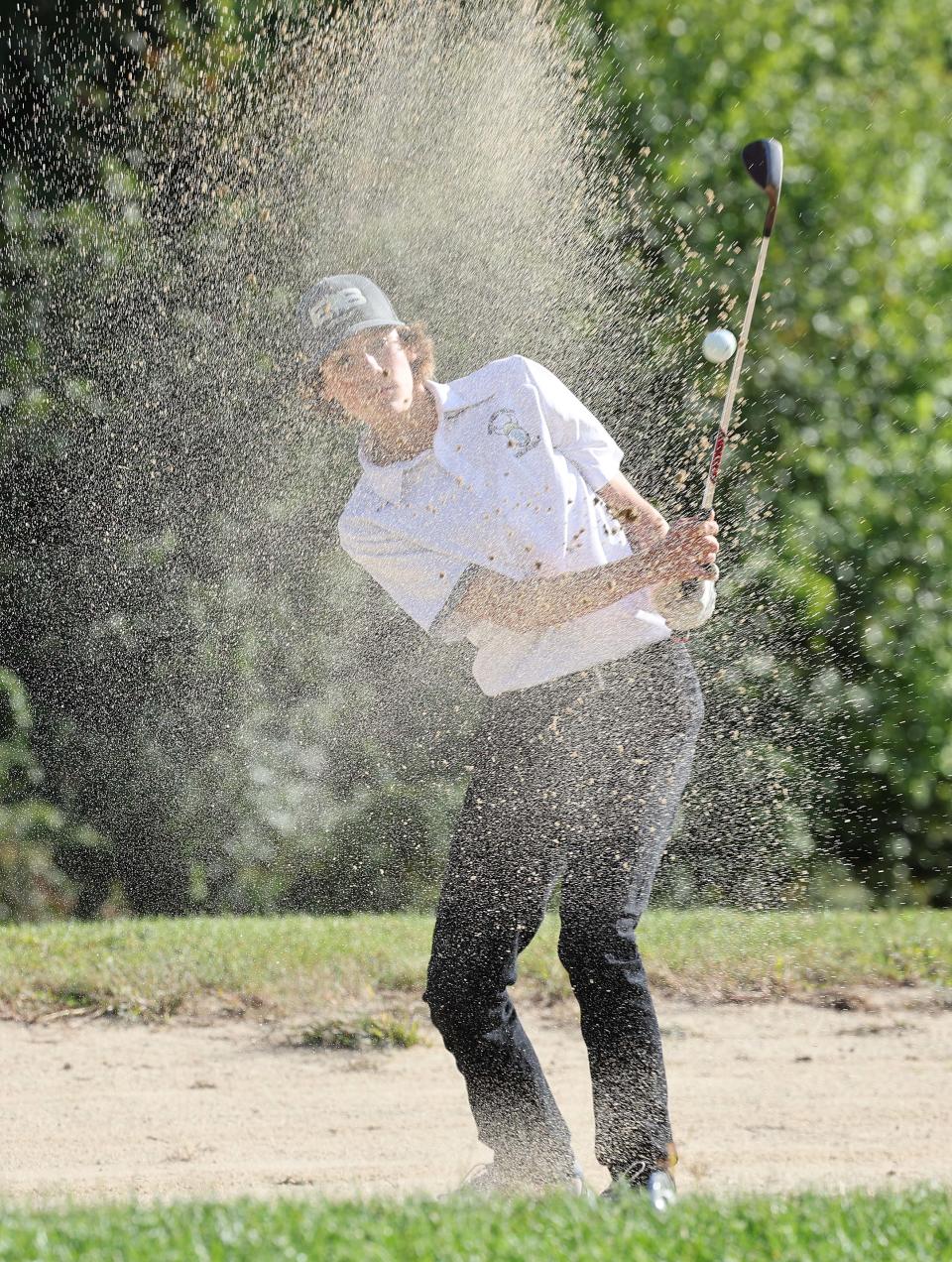 East Bridgewater's Cole Redder hits out of a sand trap at the Ridder Farm Golf Course during a match versus Abington on Thursday, Sept. 29, 2022.