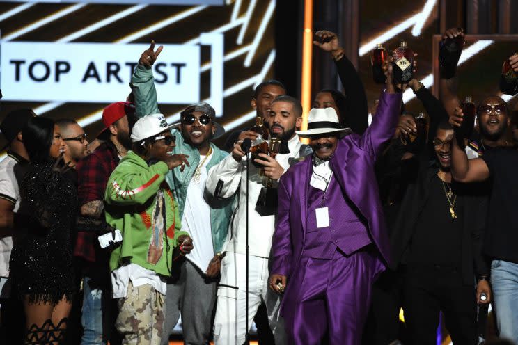 Drake's dad, Dennis Graham, helped him celebrate his Top Artist win at the 2017 Billboard Music Awards.