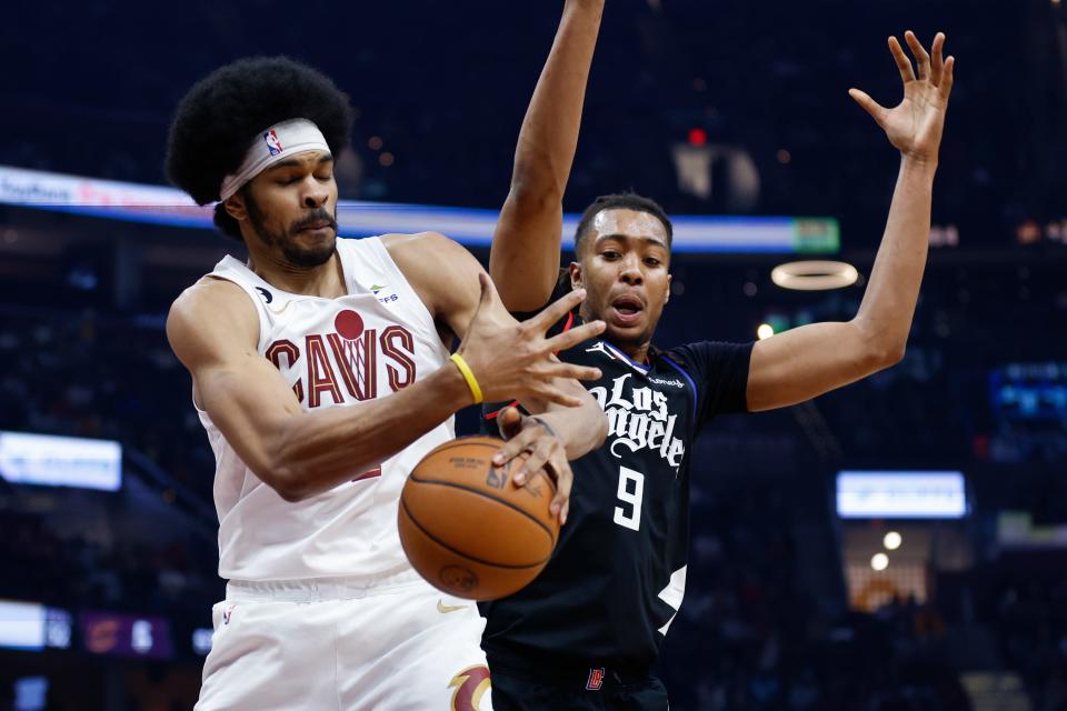 Cleveland Cavaliers center Jarrett Allen grabs a rebound against Los Angeles Clippers center Moses Brown (9) during the first half of an NBA basketball game, Sunday, Jan. 29, 2023, in Cleveland. (AP Photo/Ron Schwane)