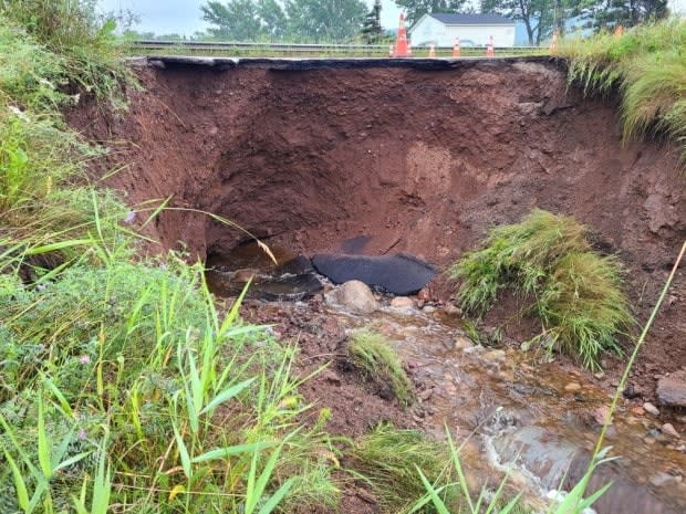 Intense rains in a short timespan Tuesday evening caused damage all around Deer Lake, according to Mayor Dean Ball, including this section of highway near the Deer Lake Powerhouse. (Submitted by Dean Ball - image credit)