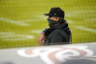 Miami Marlins manager Don Mattingly watches from the dugout during the first inning of the team's baseball game against the Atlanta Braves on Tuesday, Sept. 22, 2020, in Atlanta. Mattingly's players are quick to say their success is a reflection of their manager, who keep the season afloat with a patchwork roster until the outbreak subsided. He's considered a strong contender for National League manager of the year. (AP Photo/Brynn Anderson)