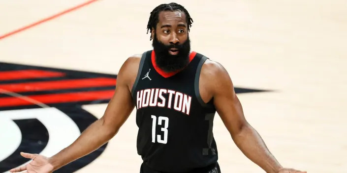 James Harden reacts and raises his hands during a Rockets game in 2020.