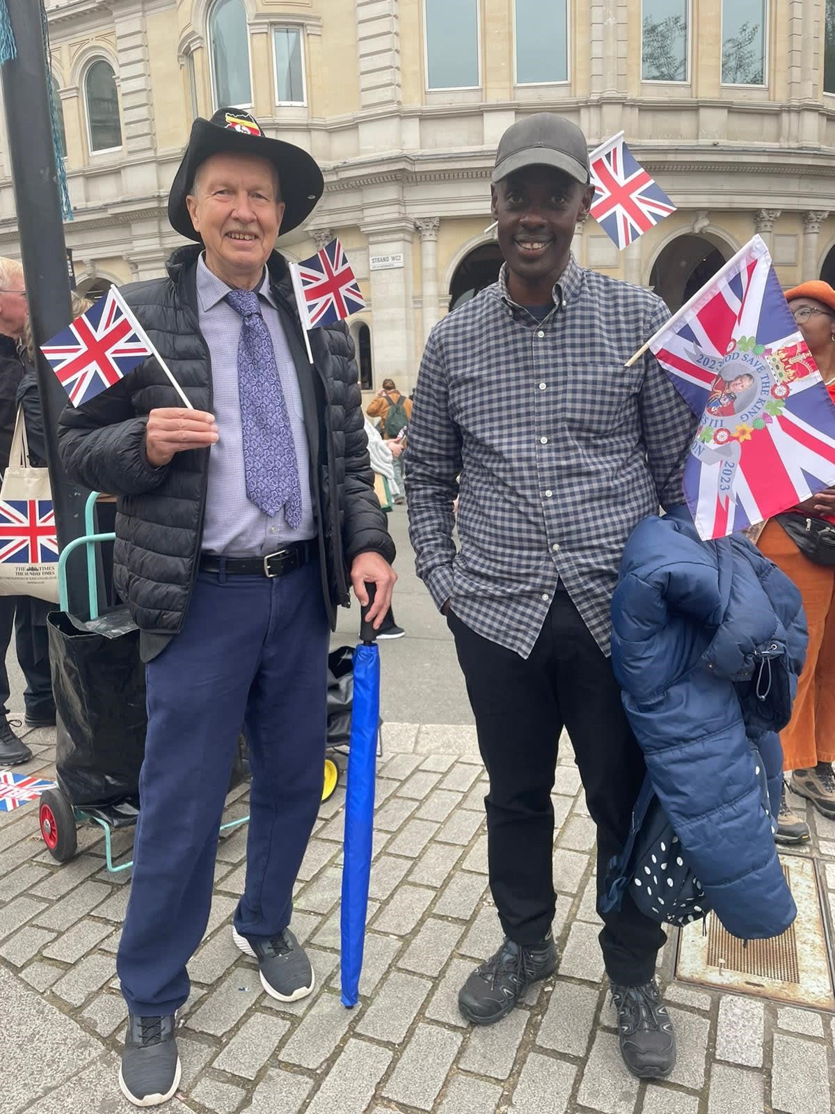 Noel Nuwe (right) flew in from Uganda to celebrate the coronation (The Independent)