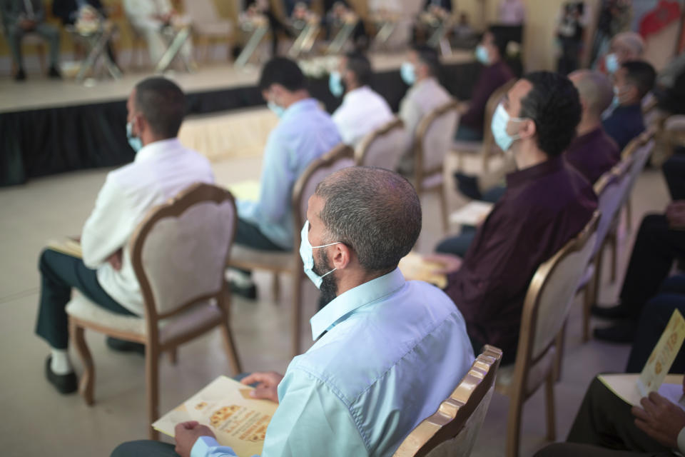 Inmates convicted on terror charges attend a ceremony that is part of a reconciliation program to rehabilitate and de-radicalize them, in Sale, Morocco, Thursday, April 28, 2022. Since 2017, Morocco's prison authority has been offering “de-radicalization” training to former Islamic State fighters and others convicted of terrorism offenses. (AP Photo/Mosa'ab Elshamy)