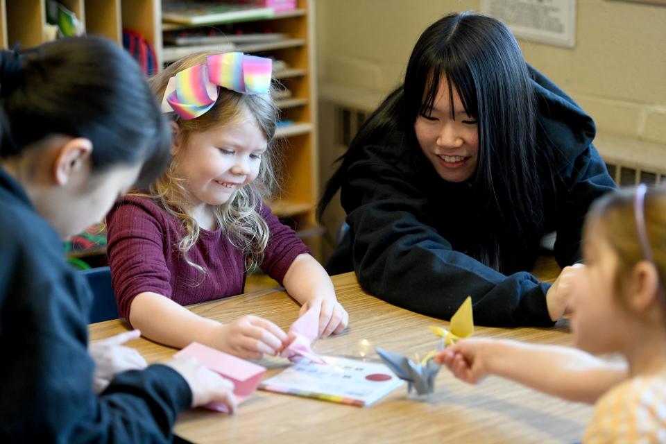 Mavis Eshelman, 4,  shares a laugh with Kimita Hoshino,   one of a group of Japanese students hosted by Mount Union and staying with host families who visited Union Avenue United Methodist Church Preschool.    Wednesday,  March 29, 2023.