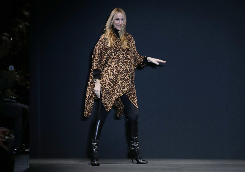 Italian fashion designer Frida Giannini acknowledges the audience after presenting her Gucci men's Fall-Winter 2013-14 collection, part of the Milan Fashion Week, unveiled in Milan, Italy, Monday, Jan. 14, 2013. (AP Photo/Antonio Calanni)