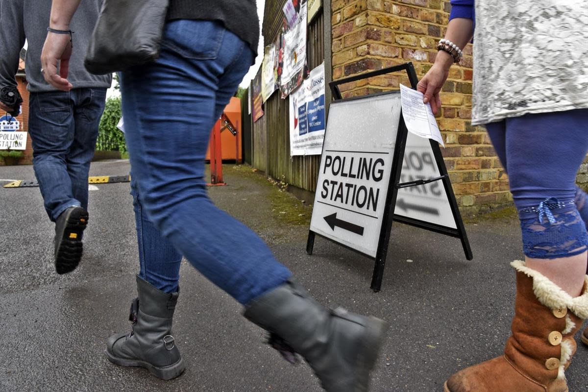 Voters arrive at a polling station. Credit: Mike Swift