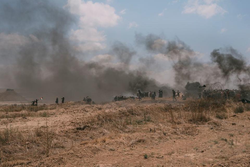 Palestinians, including a group of women, near the border fence with Israel during the demonstration.