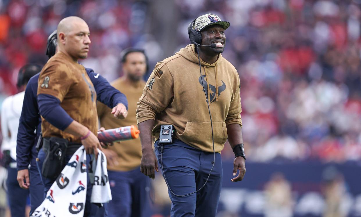 Jacques Cesaire, shouting instructions during a 2023 Houston Texans game, was hired this offseason to be the Browns defensive line coach.