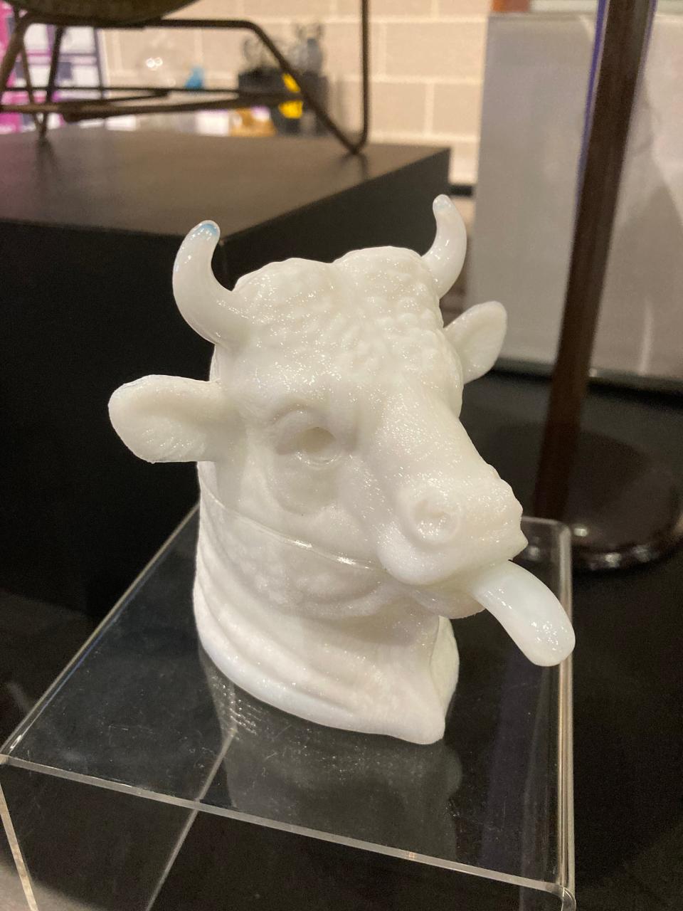 This piece of art that features a cow sticking out its tongue is among the varied artifacts from the collection of McKinley Presidential Library & Museum on display in the new Keller Gallery exhibition, "A Constellation of Objects."