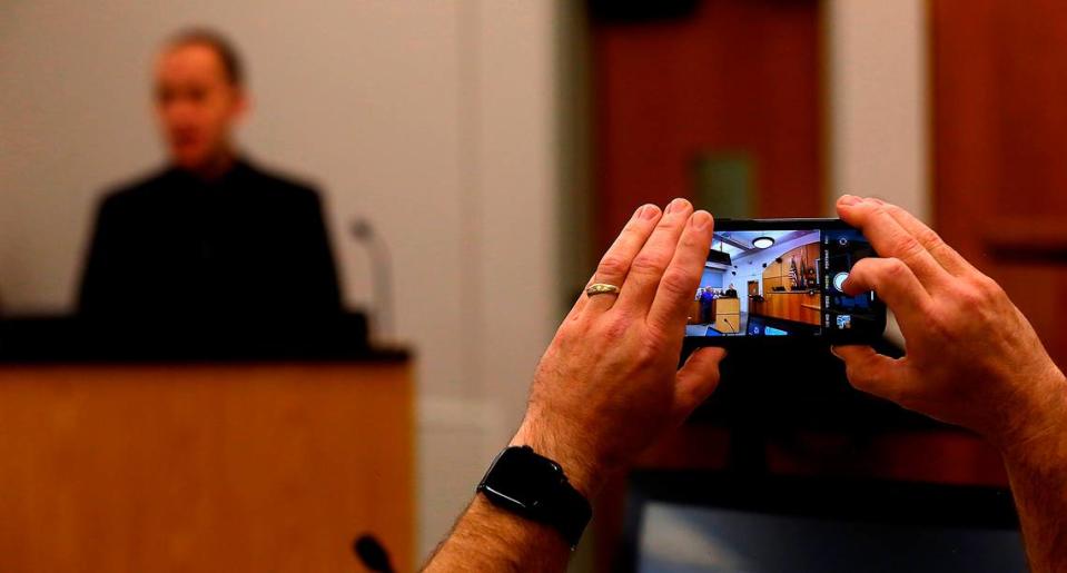 A cellphone camera captures January Wells during his graduation speech at the Benton County Veterans Therapeutic Court at the Benton County Justice Center in Kennewick.