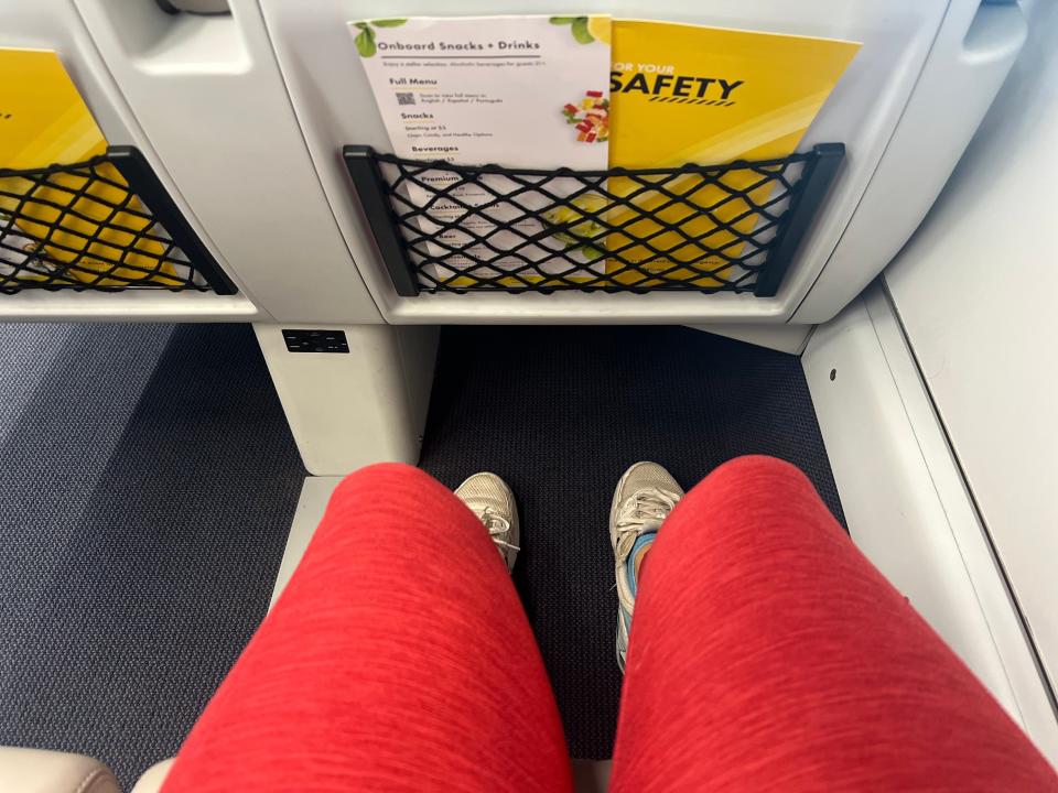 The author shows the legroom onboard the Brightline.