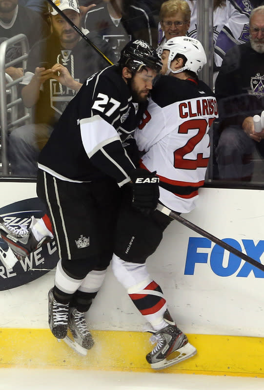 LOS ANGELES, CA - JUNE 11: Alec Martinez #27 of the Los Angeles Kings checks David Clarkson #23 of the New Jersey Devils in the second period of Game Six of the 2012 Stanley Cup Final at Staples Center on June 11, 2012 in Los Angeles, California. (Photo by Bruce Bennett/Getty Images)