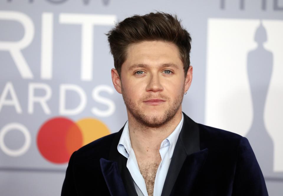 Niall Horan poses for photographers upon arrival at Brit Awards 2020 in London, Tuesday, Feb. 18, 2020.(Photo by Vianney Le Caer/Invision/AP)